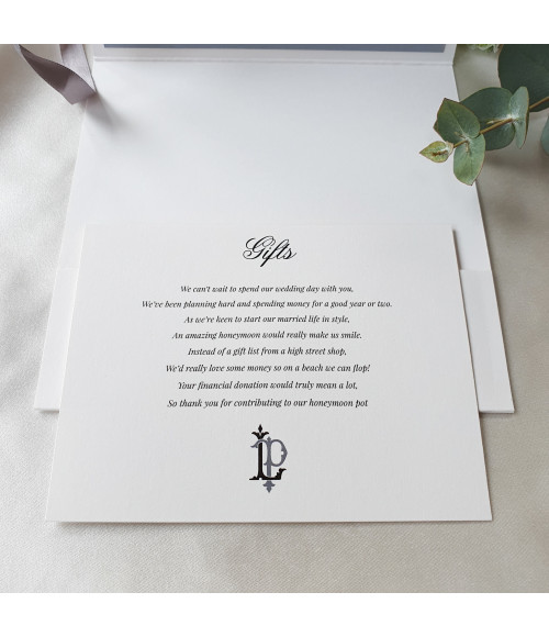 Elegant pearl white wedding stationery collection featuring silver monogram and premium card stock