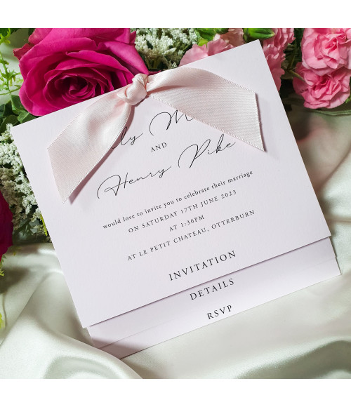 Elegant soft pink wedding invitation with smooth card and romantic blush design