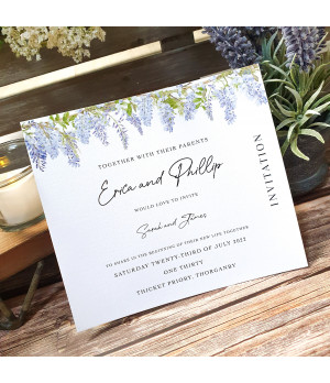 Wisteria wedding invitation with white ribbon, floral design and textured card