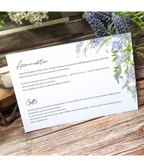 Wisteria wedding invitation with white ribbon, floral design and textured card