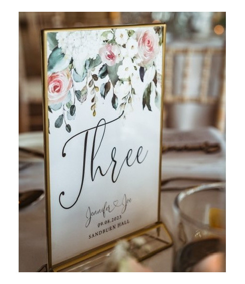 Elegant floral table number cards featuring blush pink roses and botanical details