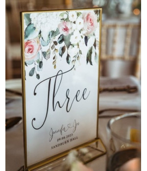 Elegant floral table number cards featuring blush pink roses and botanical details
