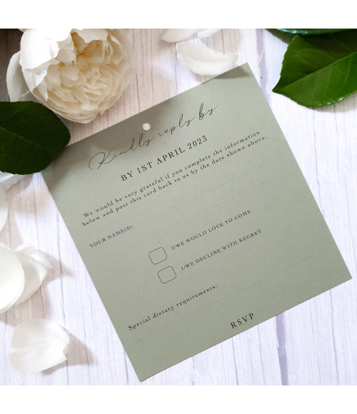 Coordinated wedding RSVP card with elegant botanical greenery design