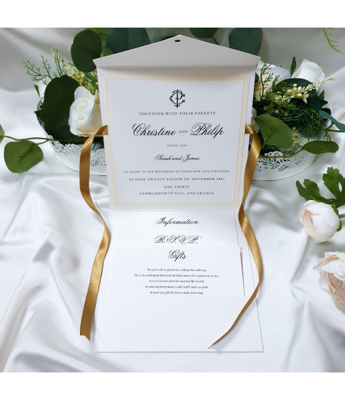 Pocket wedding invitation in gold and cream with mounted invite, personalised details and neatly arranged insert cards