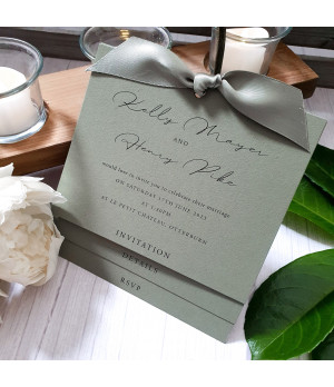 Elegant sage green wedding invitation with botanical greenery and luxury ribbon detail